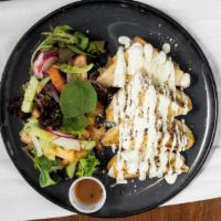 Quesadillas · Topped with cheese and sour cream. Served with side salad.