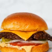 Smash Cheeseburger · Juicy, grilled beef burger smashed to perfection with American cheese, fresh shredded lettuc...