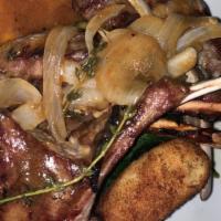 Australian Baby Lamb Chops · Simply grilled served with sautéed spinach and cannelloni beans   Topped with jus naturale.