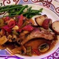 Pork Chop Caprese · Butterfly Breaded Pork Chop, Arugula, Tomato Salad, Chianti Vinegar Dressing
