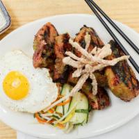 Grilled Pork Chop · Com sườn nướng, grilled pork chop with pork ears, fried egg and cucumber scallion or rau oil...