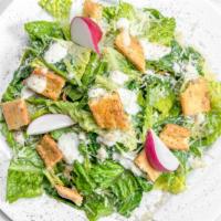 Caesar Salad · Romaine, baby kale, parmesan cheese, cracked peppercorn crackers, creamy Caesar dressing.