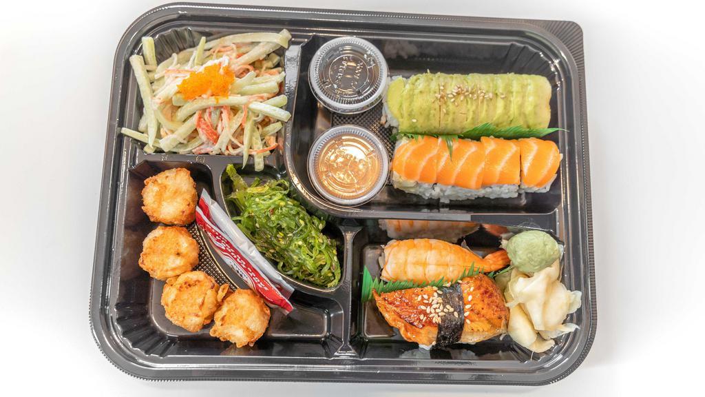 Bento Box C · Shrimp sushi, eel sushi, Dragon roll, M16 roll served with miso soup, seaweed salad, kani salad and shumai.