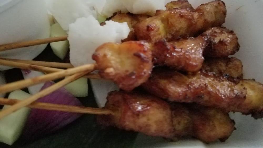 Satay Chicken (6 Pcs.) · Grilled marinated meat on a skewer with rice cube, cucumber, onion with peanut sauce.