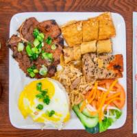 Cơm Tấm One · Grilled pork chop, pork rinds, egg quiche, egg roll, fried egg, and fried tofu stuffed with ...