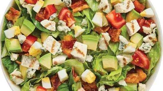 Avocado Cobb Salad · Fresh Avocado enhances this timeless classic! Served with Grilled Chicken, Chopped Tomatoes, Fresh Avocado, Sliced Egg, Smoky Bacon and Bleu Cheese. Our chef recommends the Thousand Island dressing.
