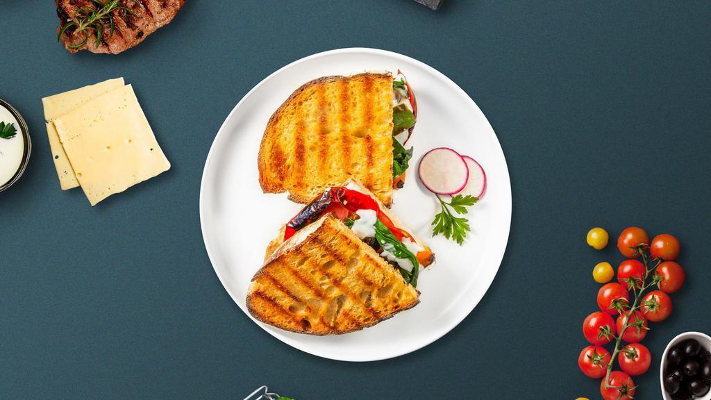 Mozzarella And Roasted Peppers Panini · Mozzarella and roasted peppers, Grilled chicken, melted cheese, lettuce, and tomato served on your choice of toasted bread.
