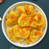 Great Garlic Knots · Savory bite sized tender dough twists slathered in garlic olive oil and baked golden brown w...