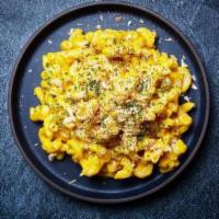 Truffle Mac And Cheese · Macaroni prepared with freshly made cheese sauce, beurre noisette, bread crumbs and white tr...