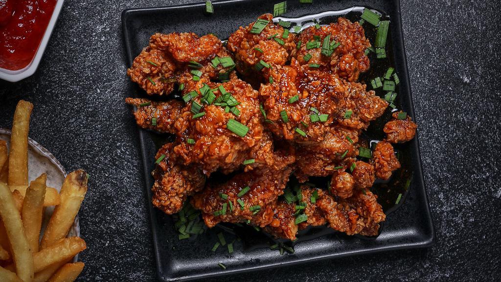 Original Soy Garlic Wings · Bell and evans wings fried in olive oil and brushed with soy and garlic sesame sauce for a bold and rich flavor.