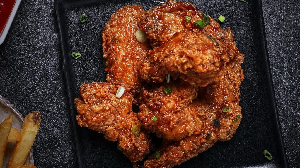 Thai Chili Wings · Bell and evans wings fried in olive oil and brushed with sweet and spicy glaze.