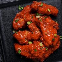 Chili Gochujang Wings · Bell and evans wings fried in olive oil and brushed with gochujang glaze for a spicy kick.