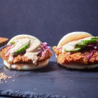 Two Fried Chicken Bao Buns · Olive oil fried panko chicken with a soy garlic glaze, cabbage slaw marinated in citrus ponz...