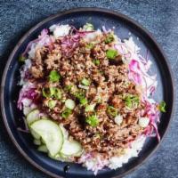 Bulgogi Rice Bowl · Thinly sliced marinated beef with pickled cucumbers, cabbage, sesame seeds, and rice.