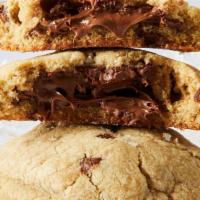 Nutella Sea Salt · Classic chocolate chip cookie with a soft Nutella filling, topped with flaky sea salt, dark ...