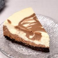 Nutella Cheesecake Slice · Nutella marble cheesecake with Oreo crust