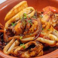 Calamari Charmoula · Grilled calamari with Moroccan spices.