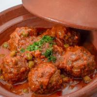 Kefta Tagine · Lamb meatballs, french green peas & Moroccan spices in a light tomato sauce.