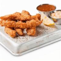 Sweetwater Catfish Fingers · Tender strips lightly-breaded with Cajun-seasoned cornmeal and flash-fried. Served with rémo...