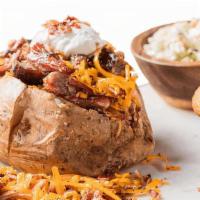 Bbq Stuffed Baked Potato · Choose from: Georgia Chopped Pork, BBQ Pulled Chicken or Texas Beef Brisket with cheddar che...