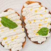 Whipped Ricotta Crostini · Charred bread, housemade whipped ricotta,
garlic confit.