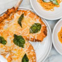 Nicky Santoro’S Veal Parm For 2 · Panko-crusted veal chop, vodka sauce, caciocavallo, Calabrian chili, fried basil. Served wit...