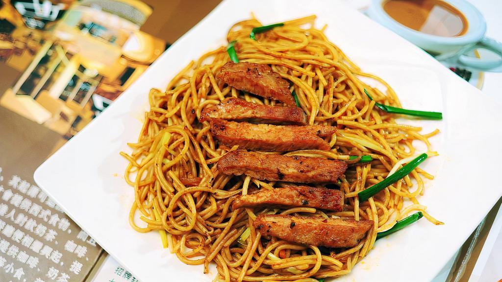 Stir-Fried Spaghetti With Pork Chop乾炒豬扒意粉 · 