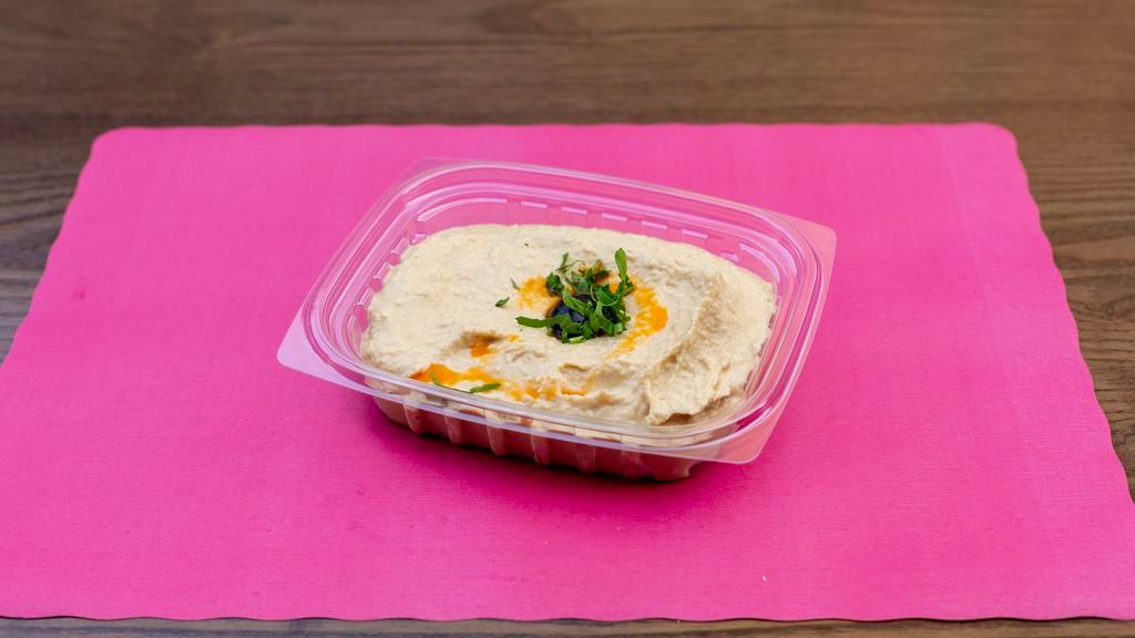 Hummus · Mashed chickpeas, blended with tahini, olive oil, lemon juice, and garlic.