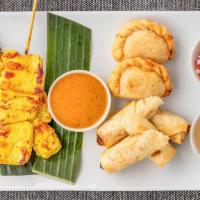 Combination Appetizers · 2 pieces of chicken sate, 2 pieces of beef satay, 2 curry puffs and 2 spring rolls.