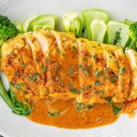 Rama The King · Spicy. Grilled chicken breast, assorted vegetables, topped with peanut sauce served with jas...
