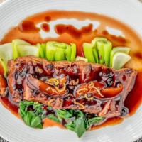 Flank Steak Tamarind · Spicy. Our house steak cook to perfection, blanch baby bok choy, shiitake mushrooms in our s...