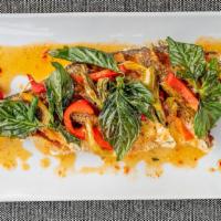 Chili Whole Fish · Spicy. Crispy whole fish of the day, chili, garlic, in a spicy sweet chili sauce served with...