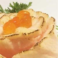 Salmon Miso · Slice of seared salmon on bed of rice with miso sauce and topped with salmon caviar.