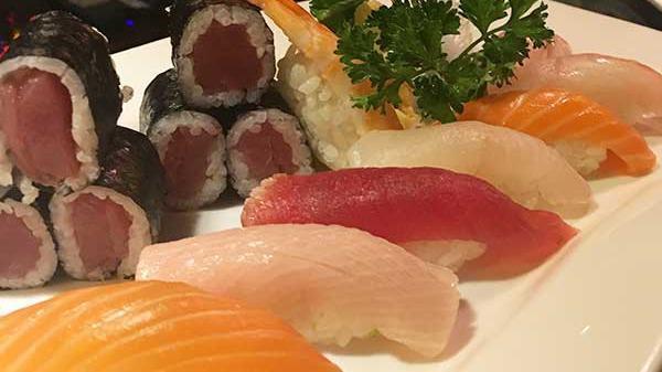 Sushi Deluxe · Nine pieces of sushi and one tuna roll. Served with miso soup or green salad.