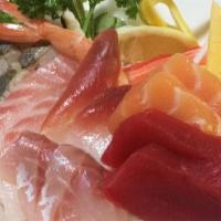 Chirashi · Assorted sliced raw fish on the bed of seasoned rice. Served with miso soup or green salad.
