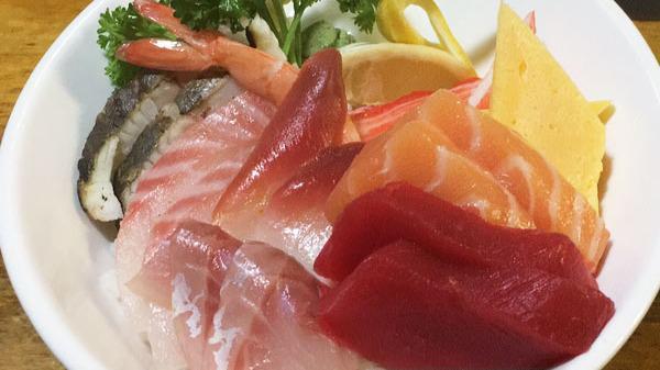 Chirashi · Assorted sliced raw fish on the bed of seasoned rice. Served with miso soup or green salad.