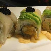 White River Roll · Spicy crunch scallop roll, topped with white tuna, avocado and tobiko.