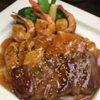 House Special Teriyaki · Shrimp, beef and chicken. Grilled with teriyaki sauce. Served with miso soup or green salad ...