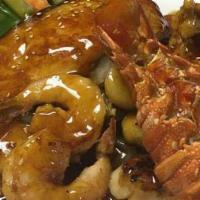 Seafood Teriyaki · Lobster, scallop, shrimp and salmon. Grilled with teriyaki sauce. Served with miso soup or g...