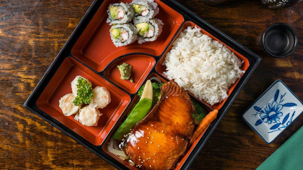 Salmon Teriyaki Bento Box · Served with rice, miso soup, green salad, California roll and shumai.