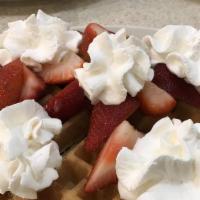 Belgian Tropical Waffle · With bananas, peach halves, fresh strawberries or mixed fruit salad & whipped cream.