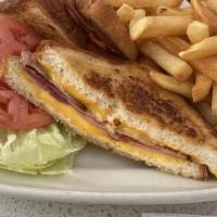 Grilled Cheese Deluxe · With lettuce, tomato & french fries, add bacon for add'l cost.
