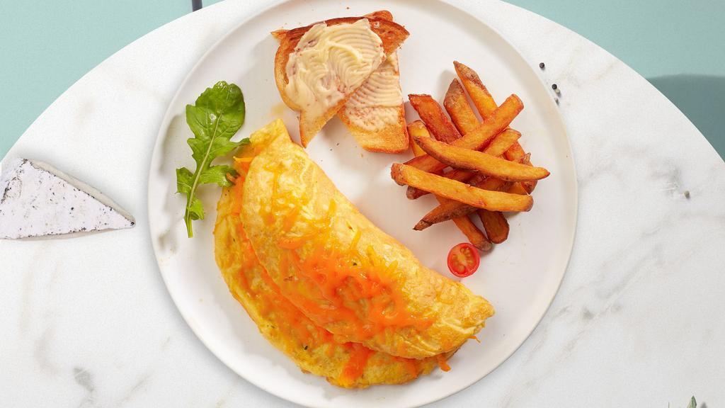 Cheesy Triad Omelette · Eggs cooked with Boar's Head® Mild Swiss, American and Wisconsin Cheddar Cheese as an omelette. Served with buttered toast and your choice of side.