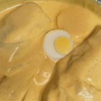 Papa A La Huancaina · Spicy cheese cream sauce over boiled potatoes