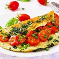 Spinach Omelette · Fresh cut spinach mixed with cheese and three whole eggs.