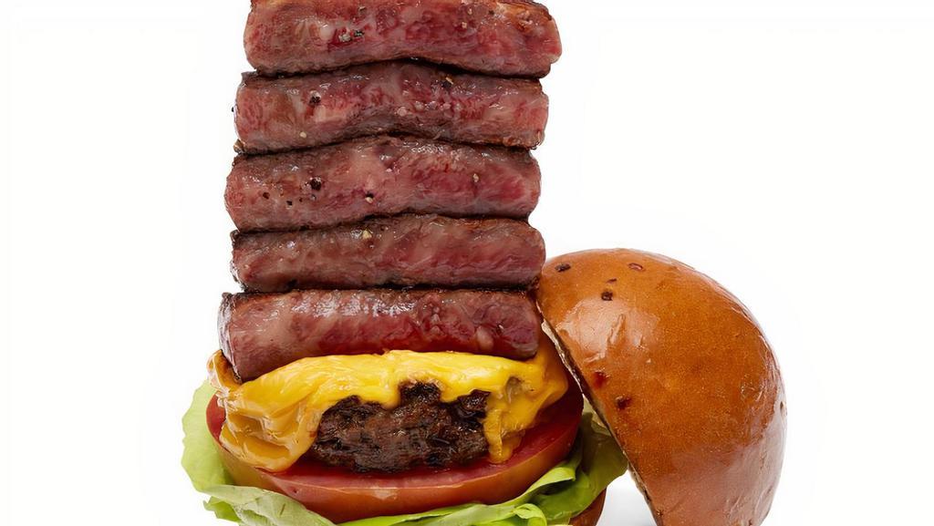 Wagyu Steak Heavenly Burger · Miyazaki A5 wagyu steak (5.2 oz) and beef patty glazed with sansho pepper sauce, tomato, and lettuce.