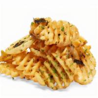 French Fries · Garlic oil and parsley.