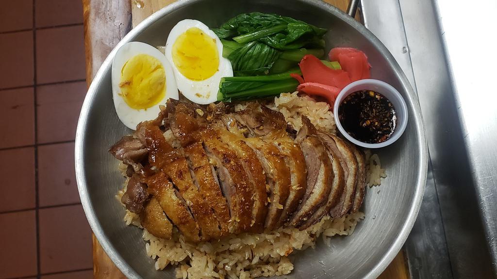 Thai Maple Duck Over Rice  · Sliced Roasted Duck, Yu- choy, ginger pickle, boiled egg with Garlic Rice and sweet soy sauce. Soup on side