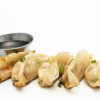 Gyoza  Veggie (5) · Fried Homemade Veggie dumpling with roasted garlic with sweet soy sauce. Vegan.