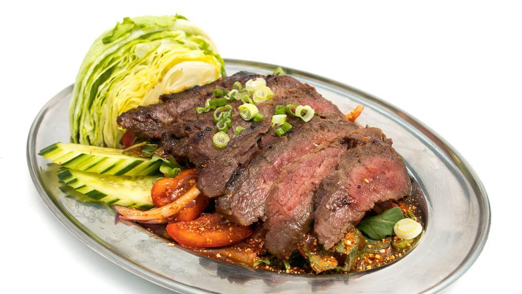 Steak Salad · Must try. Mild. Recommends. Grilled steak, green leaf, mint, tomato, cucumber, bell pepper and pineapple with homemade lime-chili paste dressing.